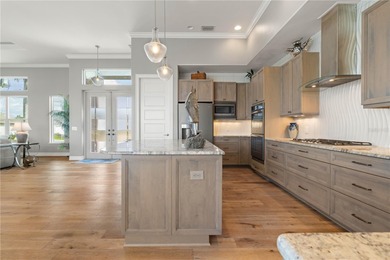 EXCEPTIONAL TWO-STORY HOME IN BSI W/FANTASTIC CANAL BASIN VIEW & on Twin Isles Country Club in Florida - for sale on GolfHomes.com, golf home, golf lot