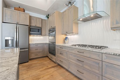 Under contract-accepting backup offers. EXCEPTIONAL TWO-STORY on Twin Isles Country Club in Florida - for sale on GolfHomes.com, golf home, golf lot