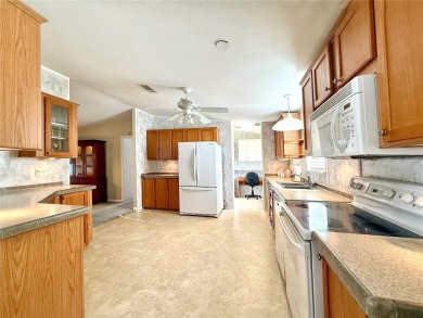 WELCOME to this spacious home in the resort-style 55+ on Apollo Beach Golf and Sea Club in Florida - for sale on GolfHomes.com, golf home, golf lot