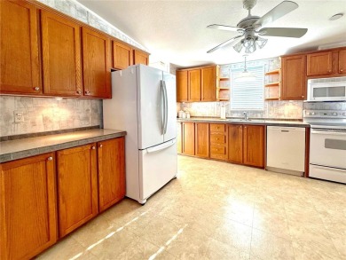 WELCOME to this spacious home in the resort-style 55+ on Apollo Beach Golf and Sea Club in Florida - for sale on GolfHomes.com, golf home, golf lot