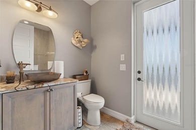 Under contract-accepting backup offers. EXCEPTIONAL TWO-STORY on Twin Isles Country Club in Florida - for sale on GolfHomes.com, golf home, golf lot