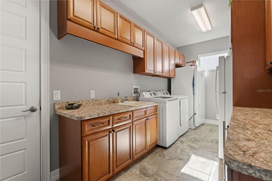 Under contract-accepting backup offers. EXCEPTIONAL TWO-STORY on Twin Isles Country Club in Florida - for sale on GolfHomes.com, golf home, golf lot