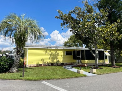 You can't beat the location of this spectacular two-bed on Lake Henry Golf Club in Florida - for sale on GolfHomes.com, golf home, golf lot