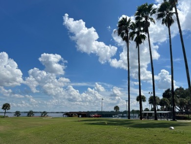 You can't beat the location of this spectacular two-bed on Lake Henry Golf Club in Florida - for sale on GolfHomes.com, golf home, golf lot