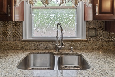 Discover serene, nature-filled living in this updated ranch home on Doe Valley Country Club in Kentucky - for sale on GolfHomes.com, golf home, golf lot
