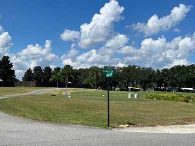 You can't beat the location of this spectacular two-bed on Lake Henry Golf Club in Florida - for sale on GolfHomes.com, golf home, golf lot