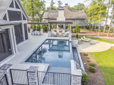 Welcome to this breathtaking waterfront retreat, where luxury on Reynolds Lake Oconee - The Oconee in Florida - for sale on GolfHomes.com, golf home, golf lot