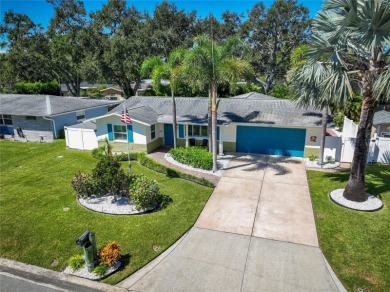 YOUR OWN PERSONAL PRIVATE PARADISE IN DELIGHTFUL DUNEDIN on The Dunedin Country Club in Florida - for sale on GolfHomes.com, golf home, golf lot