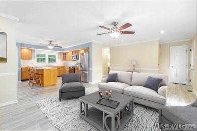 Enjoy main lake views and water-access living from this cape cod on Tanglewood Shores Golf Club in Virginia - for sale on GolfHomes.com, golf home, golf lot