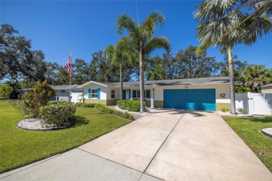 YOUR OWN PERSONAL PRIVATE PARADISE IN DELIGHTFUL DUNEDIN on The Dunedin Country Club in Florida - for sale on GolfHomes.com, golf home, golf lot
