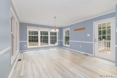 Enjoy main lake views and water-access living from this cape cod on Tanglewood Shores Golf Club in Virginia - for sale on GolfHomes.com, golf home, golf lot