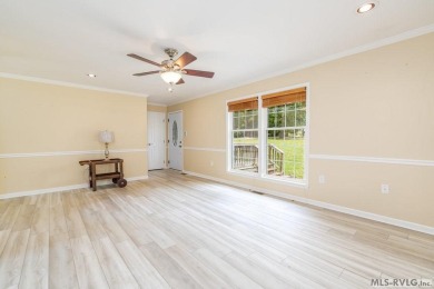 Enjoy main lake views and water-access living from this cape cod on Tanglewood Shores Golf Club in Virginia - for sale on GolfHomes.com, golf home, golf lot