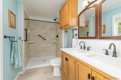 Enjoy main lake views and water-access living from this cape cod on Tanglewood Shores Golf Club in Virginia - for sale on GolfHomes.com, golf home, golf lot