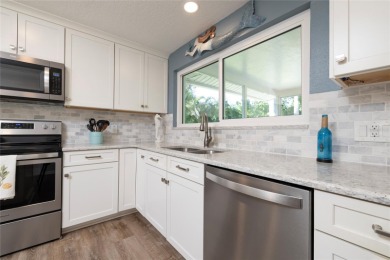 YOUR OWN PERSONAL PRIVATE PARADISE IN DELIGHTFUL DUNEDIN on The Dunedin Country Club in Florida - for sale on GolfHomes.com, golf home, golf lot