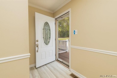 Enjoy main lake views and water-access living from this cape cod on Tanglewood Shores Golf Club in Virginia - for sale on GolfHomes.com, golf home, golf lot