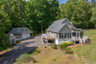 Enjoy main lake views and water-access living from this cape cod on Tanglewood Shores Golf Club in Virginia - for sale on GolfHomes.com, golf home, golf lot