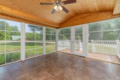 Enjoy main lake views and water-access living from this cape cod on Tanglewood Shores Golf Club in Virginia - for sale on GolfHomes.com, golf home, golf lot