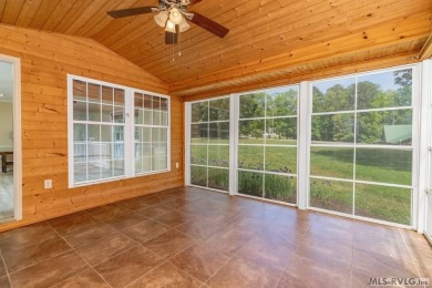 Enjoy main lake views and water-access living from this cape cod on Tanglewood Shores Golf Club in Virginia - for sale on GolfHomes.com, golf home, golf lot