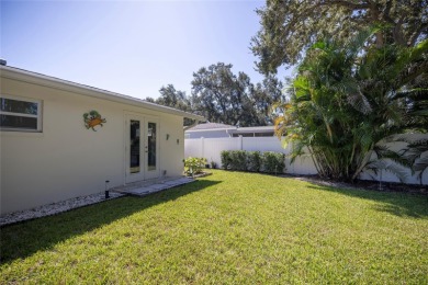 YOUR OWN PERSONAL PRIVATE PARADISE IN DELIGHTFUL DUNEDIN on The Dunedin Country Club in Florida - for sale on GolfHomes.com, golf home, golf lot