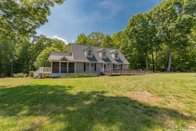 Enjoy main lake views and water-access living from this cape cod on Tanglewood Shores Golf Club in Virginia - for sale on GolfHomes.com, golf home, golf lot