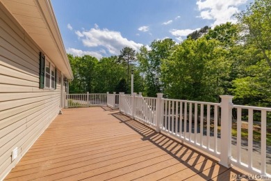 Enjoy main lake views and water-access living from this cape cod on Tanglewood Shores Golf Club in Virginia - for sale on GolfHomes.com, golf home, golf lot