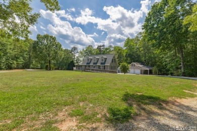 Enjoy main lake views and water-access living from this cape cod on Tanglewood Shores Golf Club in Virginia - for sale on GolfHomes.com, golf home, golf lot