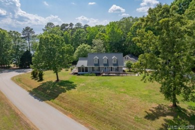 Enjoy main lake views and water-access living from this cape cod on Tanglewood Shores Golf Club in Virginia - for sale on GolfHomes.com, golf home, golf lot