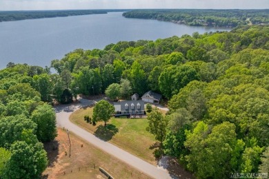 Enjoy main lake views and water-access living from this cape cod on Tanglewood Shores Golf Club in Virginia - for sale on GolfHomes.com, golf home, golf lot