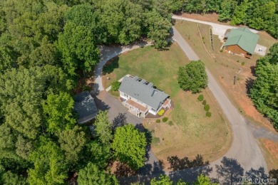 Enjoy main lake views and water-access living from this cape cod on Tanglewood Shores Golf Club in Virginia - for sale on GolfHomes.com, golf home, golf lot
