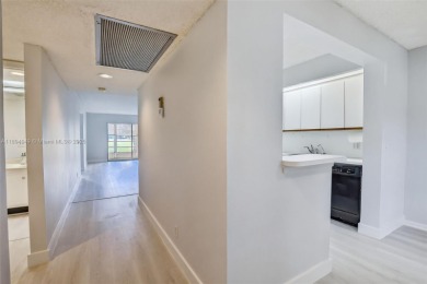 Freshly painted and newly floored ground-floor 2-bedroom on Flamingo Lakes Country Club in Florida - for sale on GolfHomes.com, golf home, golf lot