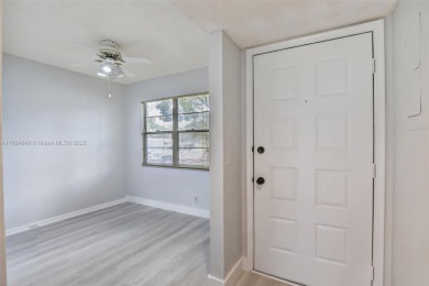 Freshly painted and newly floored ground-floor 2-bedroom on Flamingo Lakes Country Club in Florida - for sale on GolfHomes.com, golf home, golf lot