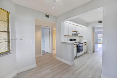 Freshly painted and newly floored ground-floor 2-bedroom on Flamingo Lakes Country Club in Florida - for sale on GolfHomes.com, golf home, golf lot