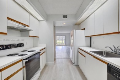 Freshly painted and newly floored ground-floor 2-bedroom on Flamingo Lakes Country Club in Florida - for sale on GolfHomes.com, golf home, golf lot
