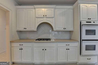 Welcome to this gorgeous 4 bed / 3.5 bath, BRICK, MASTER ON MAIN on Laurel Springs Golf Club in Georgia - for sale on GolfHomes.com, golf home, golf lot