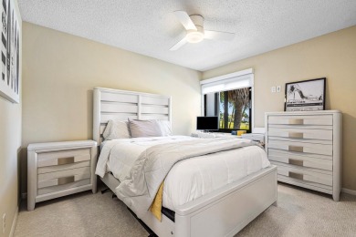WALK TO EVERYTHING Renovated inside and out, new roofs, fencing on Boca West Golf and Country Club in Florida - for sale on GolfHomes.com, golf home, golf lot