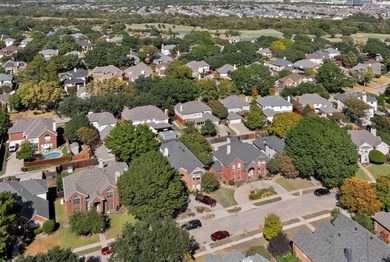 Stunning Traditional-style home featuring a symmetrical brick on The Courses at Watters Creek in Texas - for sale on GolfHomes.com, golf home, golf lot