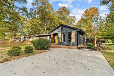 This beautiful 3-bedroom, 2-bathroom home is located just steps on Dalton Golf and Country Club in Georgia - for sale on GolfHomes.com, golf home, golf lot