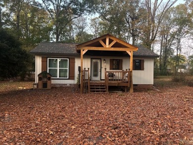 This beautiful 3-bedroom, 2-bathroom home is located just steps on Dalton Golf and Country Club in Georgia - for sale on GolfHomes.com, golf home, golf lot