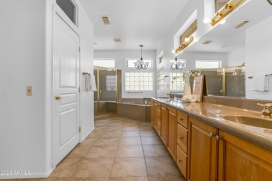 Located in The Point at The Grand in Surprise, this impeccably on Granite Falls Golf Club  in Arizona - for sale on GolfHomes.com, golf home, golf lot