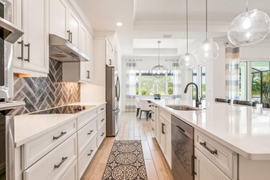 Sleek, smart, and solar-powered--this lavishly upgraded custom on Bent Pine Golf Club in Florida - for sale on GolfHomes.com, golf home, golf lot