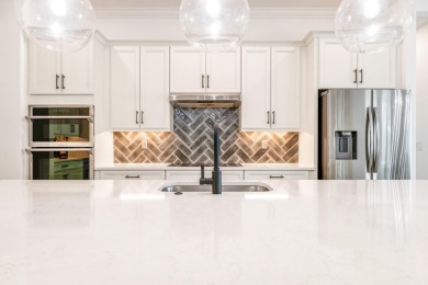 Sleek, smart, and solar-powered--this lavishly upgraded custom on Bent Pine Golf Club in Florida - for sale on GolfHomes.com, golf home, golf lot