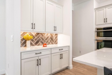 Sleek, smart, and solar-powered--this lavishly upgraded custom on Bent Pine Golf Club in Florida - for sale on GolfHomes.com, golf home, golf lot