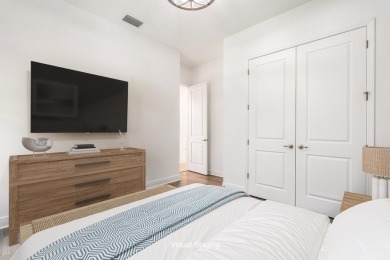 Sleek, smart, and solar-powered--this lavishly upgraded custom on Bent Pine Golf Club in Florida - for sale on GolfHomes.com, golf home, golf lot