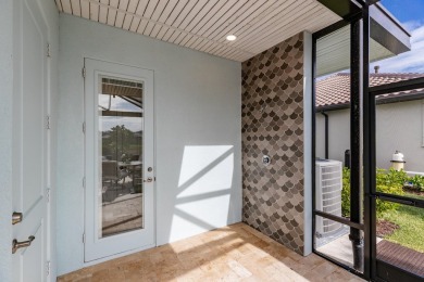 Sleek, smart, and solar-powered--this lavishly upgraded custom on Bent Pine Golf Club in Florida - for sale on GolfHomes.com, golf home, golf lot