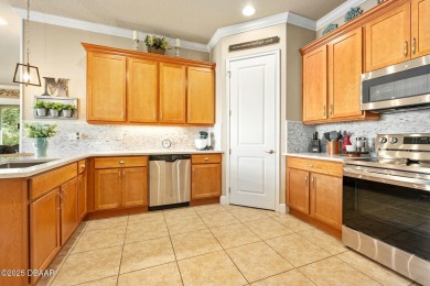 Maintenance-Free Living in Plantation Bay! This beautifully on Plantation Bay Golf and Country Club in Florida - for sale on GolfHomes.com, golf home, golf lot
