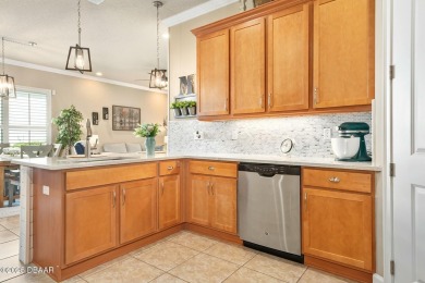Maintenance-Free Living in Plantation Bay! This beautifully on Plantation Bay Golf and Country Club in Florida - for sale on GolfHomes.com, golf home, golf lot