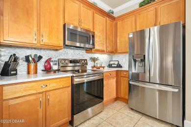Maintenance-Free Living in Plantation Bay! This beautifully on Plantation Bay Golf and Country Club in Florida - for sale on GolfHomes.com, golf home, golf lot