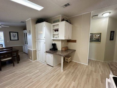 Discover this charming 1996 Homes of Merit "TURNKEY" on Four Lakes Golf Club in Florida - for sale on GolfHomes.com, golf home, golf lot