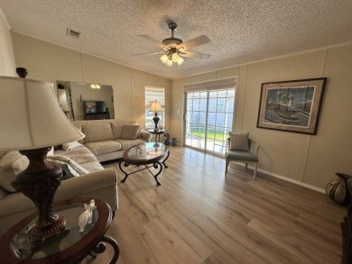 Discover this charming 1996 Homes of Merit "TURNKEY" on Four Lakes Golf Club in Florida - for sale on GolfHomes.com, golf home, golf lot