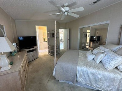 Discover this charming 1996 Homes of Merit "TURNKEY" on Four Lakes Golf Club in Florida - for sale on GolfHomes.com, golf home, golf lot